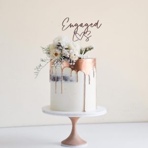 Tall Rose Gold Drip Engagement Cake