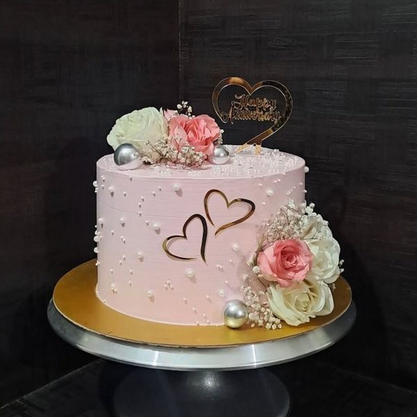 Pink Floral Anniversary Cake With White Pearls