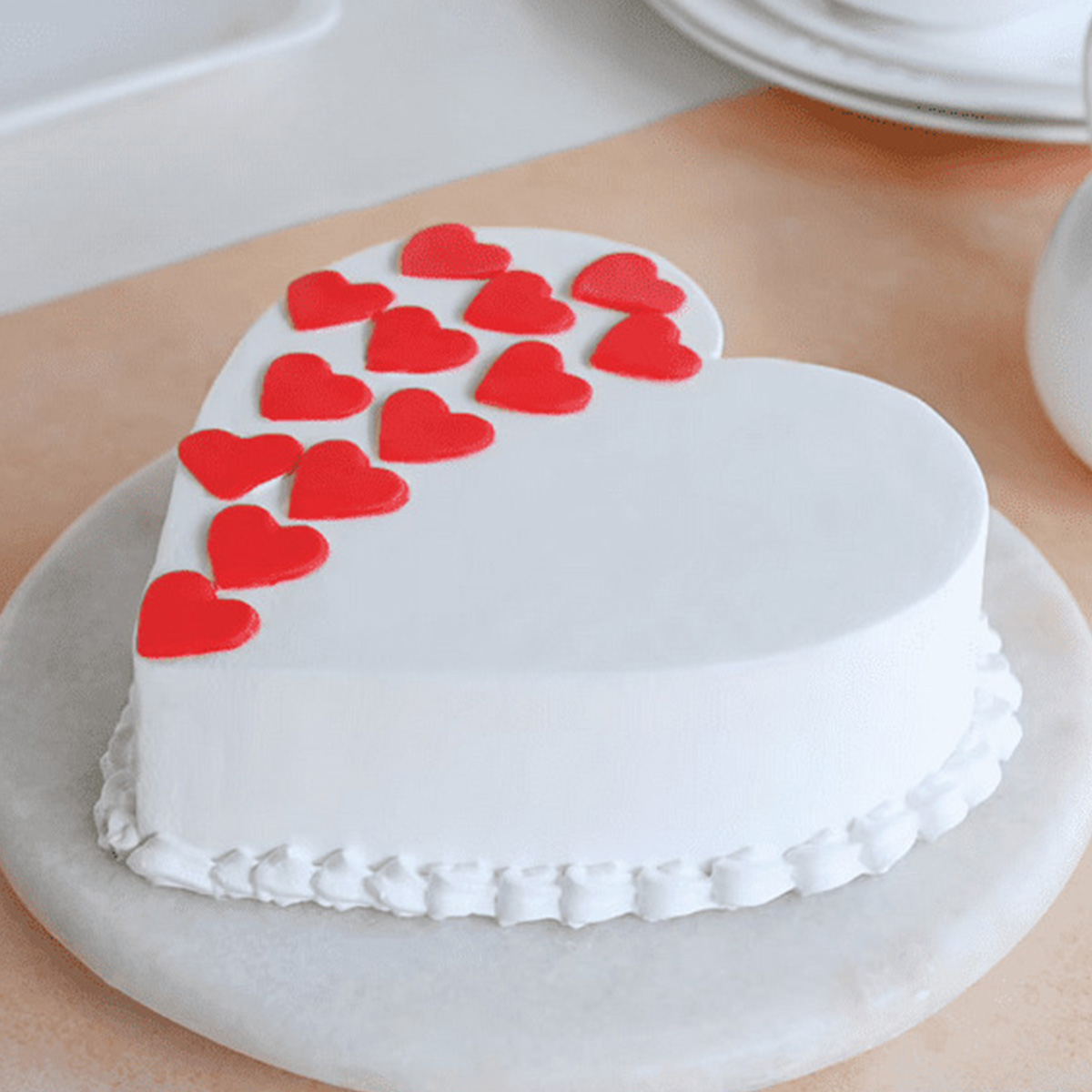 White Heart Shaped Cake with Multiple Red Heart Cakes 1 White Heart Shaped Cake with Multiple Red Heart Cakes